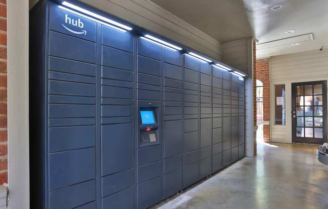 a row of blue lockers with the hub logo on the top