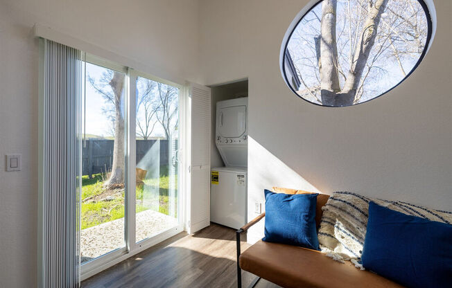 a living room with a large window and a couch