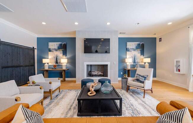 A living room with a fireplace and a television.
