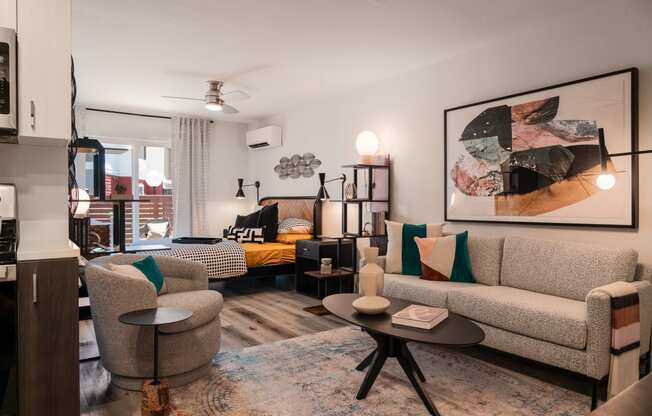 a living room with couches and chairs and a table