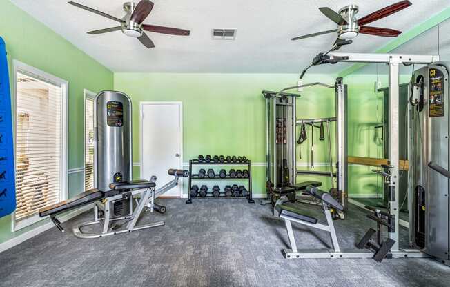 the gym in the owners home is equipped with weights and other equipment