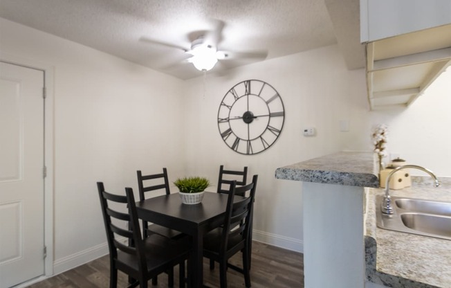 This is a photo of the dining area of the 515 square foot 1 bedroom apartment at Canyon Creek Apartments in Dallas, TX