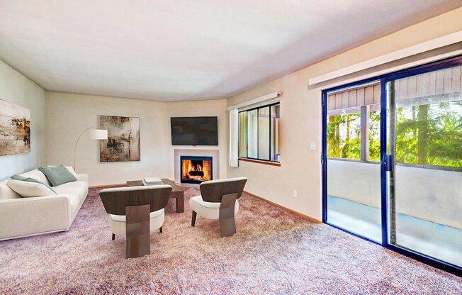 a living room with a couch and chairs and a fireplace