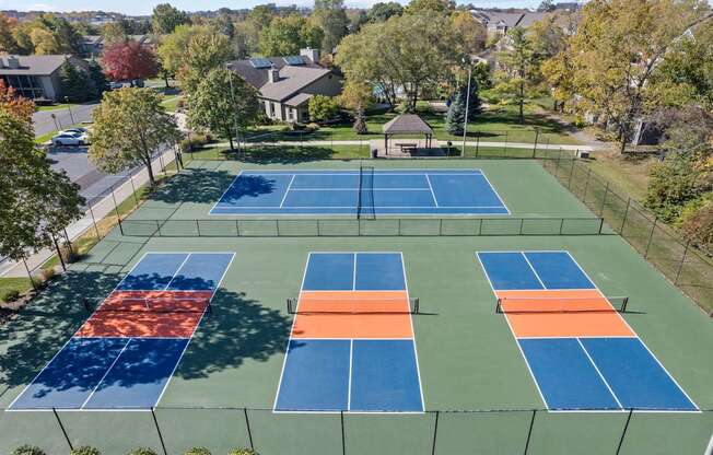 an aerial view of the tennis courts on the neighbourhood neighbourhood tennis court