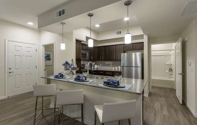 Wooden cabinets in kitchen with breakfast bar at The View at Horizon Ridge, Henderson, Nevada