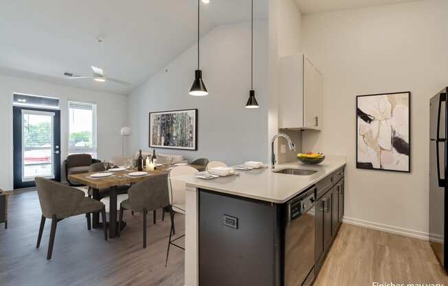 a kitchen and dining area in a 555 waverly unit