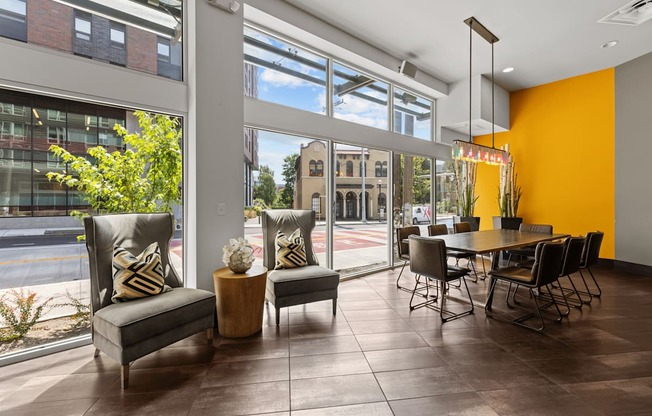 the preserve at ballantyne commons clubhouse with dining table and large windows