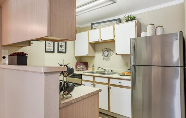 Stainless Steel Refrigerator and Painted Cabinets Talavera Apartment Kitchen