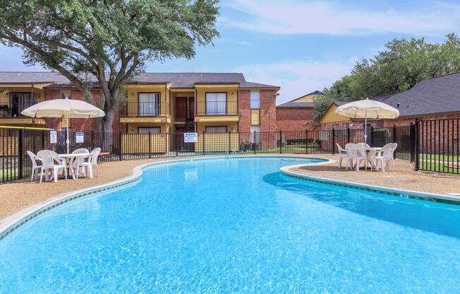 a blue pool of water in front of a house