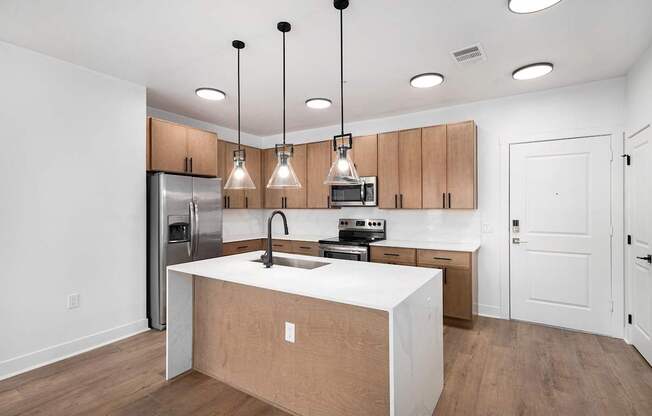 A kitchen with wooden cabinets and a white countertop.