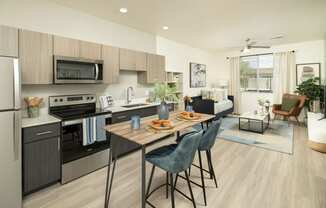 a kitchen and living room in a 555 waverly unit