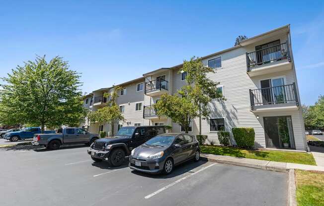 Resident parking lot in front of property building at Park Edmonds Apartment Homes, Edmonds, WA