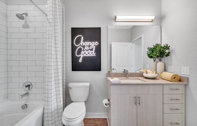 a bathroom with a sink toilet and a bath tub