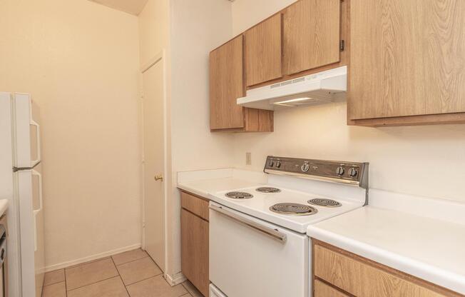 a kitchen with a stove and a sink