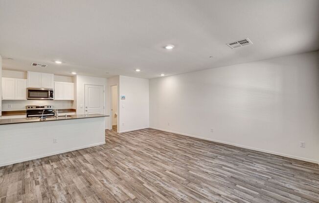 Adorable BRAND NEW three bedroom townhome with a 2 car garage in Tule Springs!