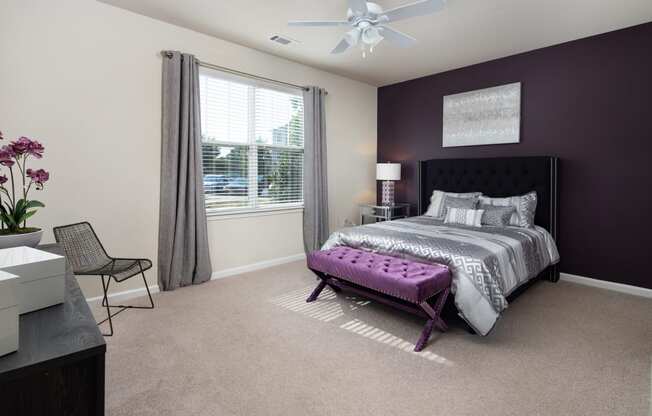 one of the bedrooms at the enclave at woodbridge apartments in sugar land, tx