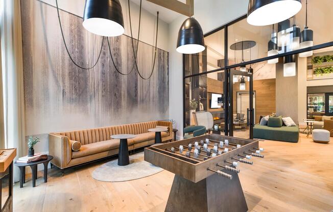 Unwind in the modern resident lounge, complete with stylish seating and a foosball table for casual fun.