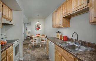 a kitchen with a sink and a table