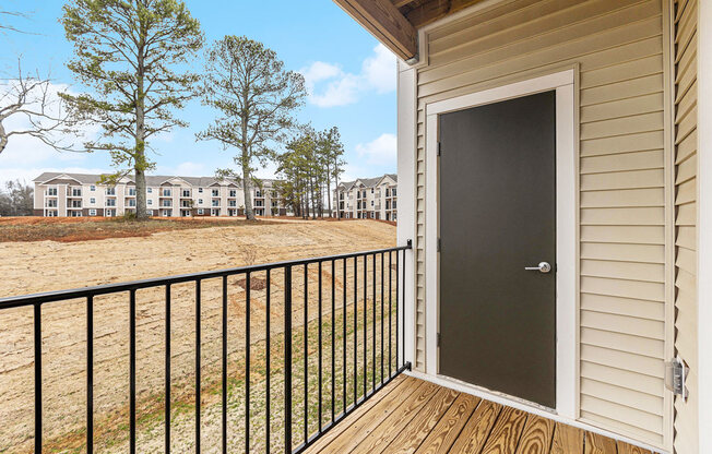 a door on a balcony with enclosed storage  at Signature Pointe Apartment Homes, Athens