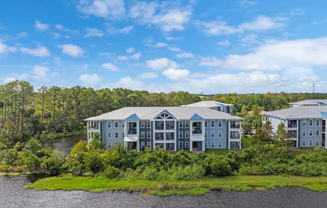 a large building with a river in front of it