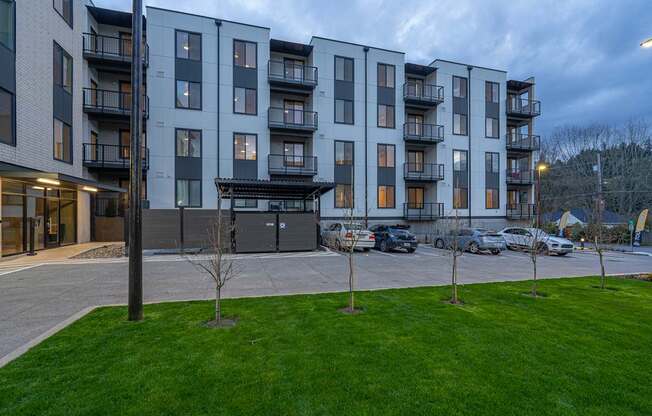 an exterior view of an apartment building at dusk