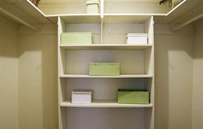 a shelf in a closet with boxes on it at Gates of West Bay, Norfolk, 23503