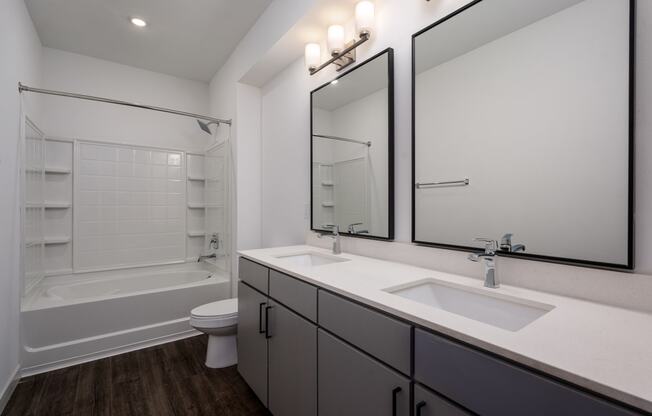 a bathroom with a sink and a shower and a toilet