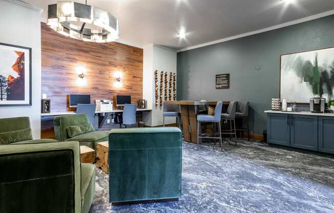 a living room with green furniture and a blue rug at The links at Plum Creek Apartments, Castlerock, CO 80104