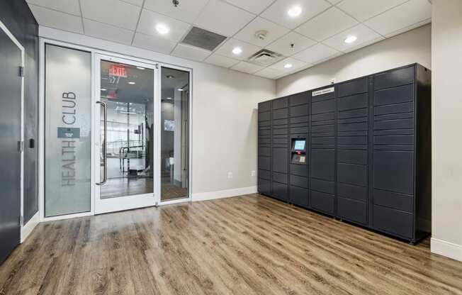 a room with a lockers and a door to a cyber room