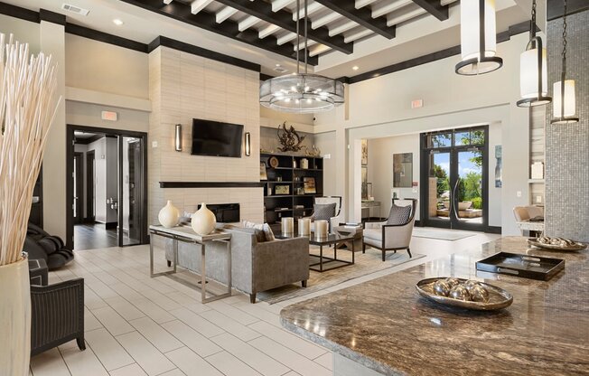 a large living room with a fireplace and a table