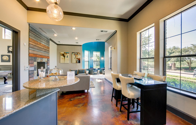 View of Clubhouse, Showing Snacks, Seating Area, Windows and Polished Concrete Flooring at Enclave on Golden Triangle Apartments