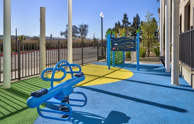 a blue bench in a park