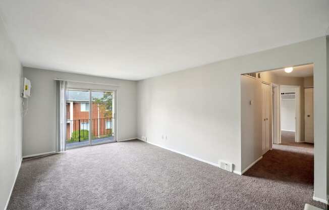 Spacious living room with natural light at Riverstone Apartments in Southfield, MI