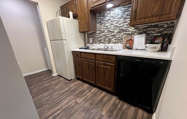 a kitchen with a wooden floor