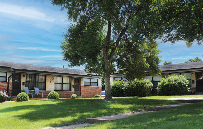 apartment complex with landscaping