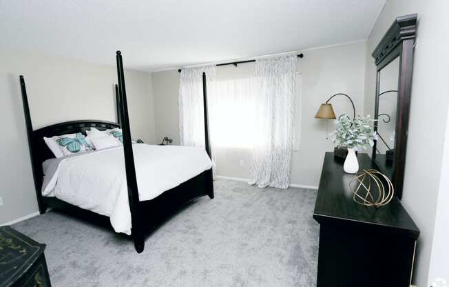 Bedroom with window at  Canyon Club Apartments, Upland, California