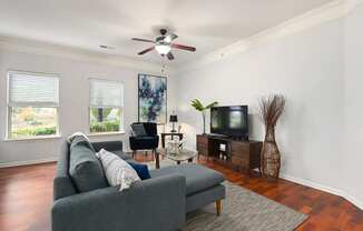 a living room with a couch and a ceiling fan at Sovereign at Overland Park, Overland Park, KS  