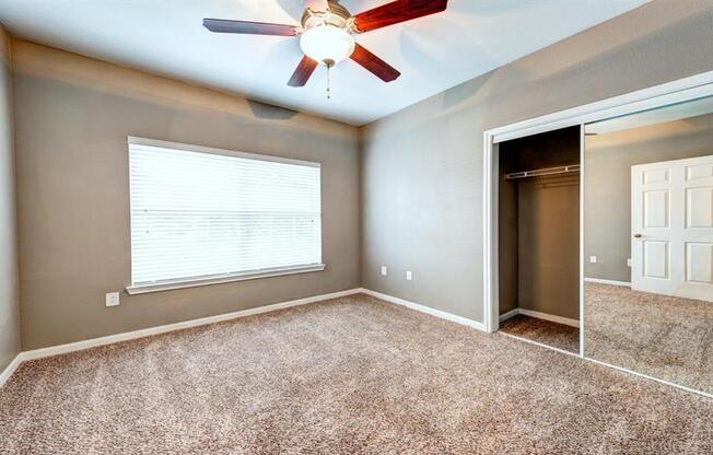 Bedroom with glass sliding closet doors