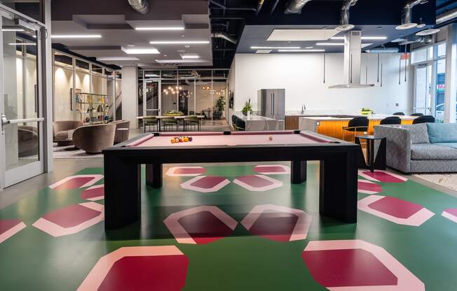 a games room with a ping pong table