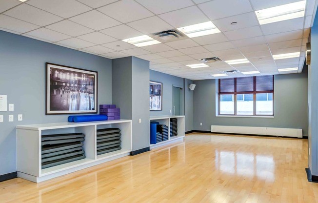 Yoga studio with polished birch flooring and loaner mats