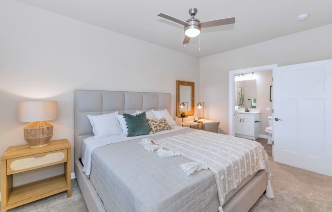 a bedroom with a large bed and a ceiling fanat Solace at Ballpark Village, Goodyear, AZ