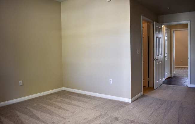 view of hallway leading to second bedroom