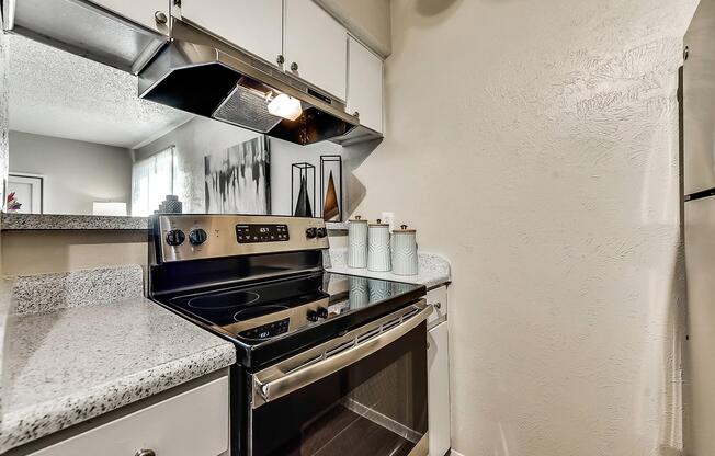 a kitchen with a stove and a sink