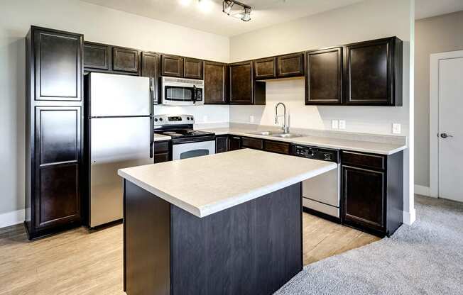 Kitchen with dark cabinets at Tamarin Ridge in Lincoln, NE