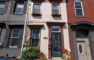 Updated South Side townhome with a private fenced backyard and walkable location.