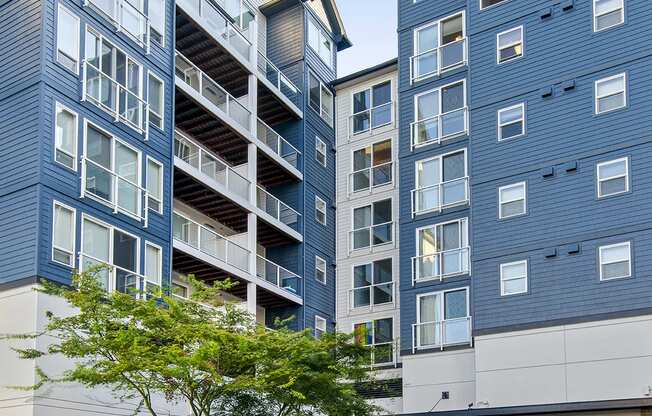 a group of modern buildings with a street in front of them