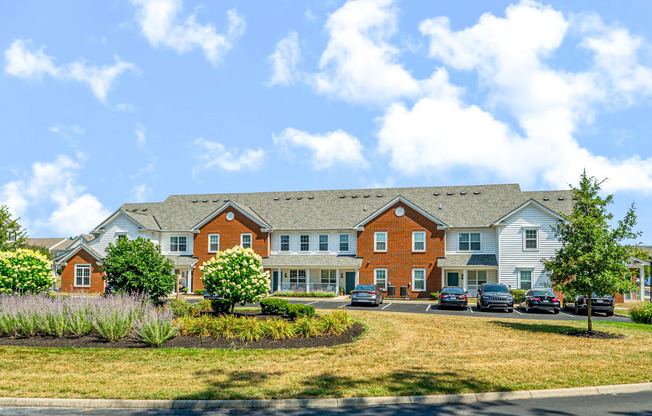 a large building with cars parked in front of it