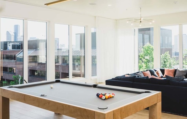 Clubroom with chic lounge areas and a pool table