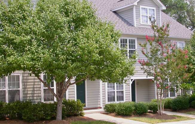a house with a tree in front of it