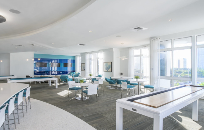 Community lounge and kitchen with blue accents in a Midtown Miami apartment community.
